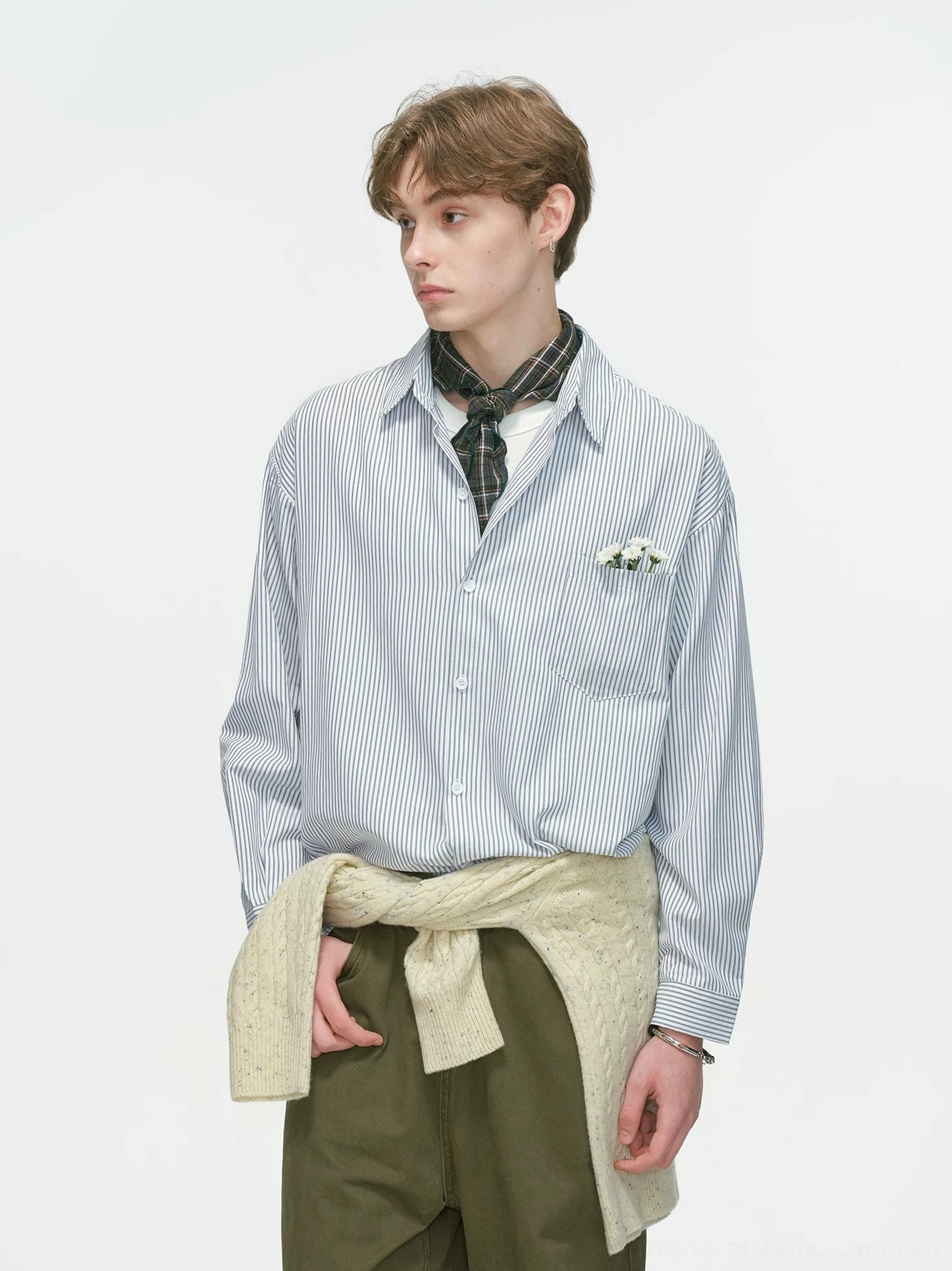 Grey thin vertical stripe relaxed button-down overshirt styled with olive wide-leg pants, plaid neck scarf, and flower brooch