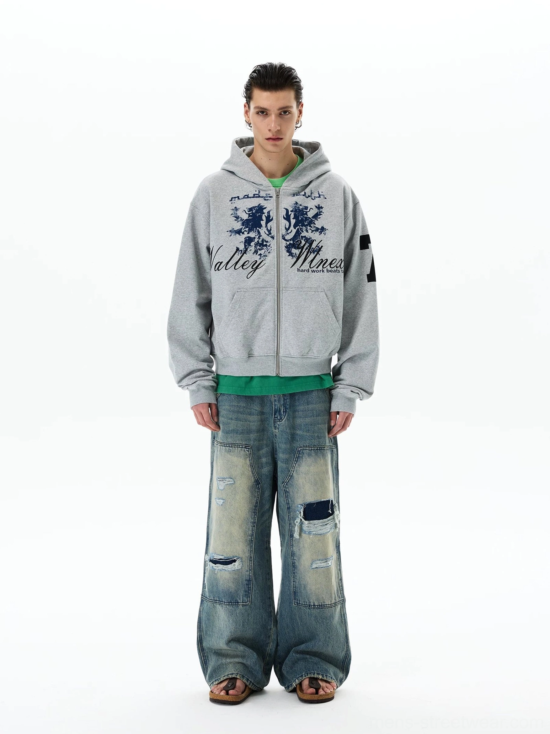 Relaxed fit grey vintage collegiate zip hoodie with navy crest lettering, sleeve number 7 graphic, attached hood, and oversized streetwear styling