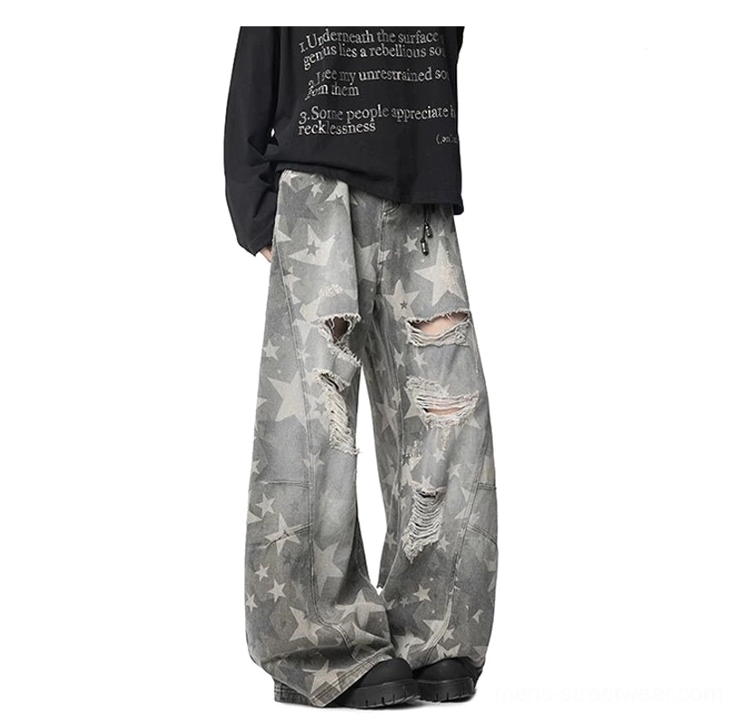 Grey vintage wash star print ripped baggy jeans straight front view with extra wide legs