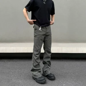 Gunmetal gray men’s flared techwear trousers front three-quarter view featuring a clean tailored streetwear silhouette and waist zip detail