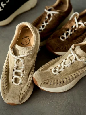 Handwoven suede runner sneakers shown from above with braided vamp detailing, contrasting off-white rubber soles, and cushioned leather insoles