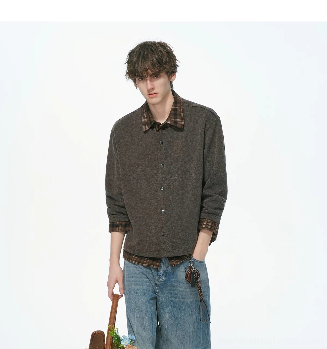 Close-up three-quarter view of a heather brown plaid collar layered knit shirt jacket with contrasting trim