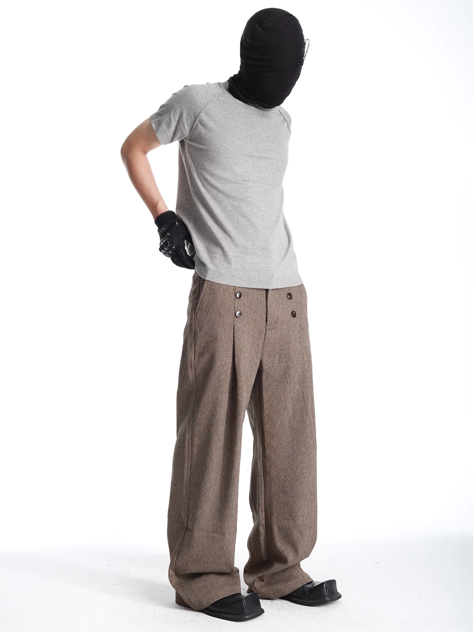 Back three-quarter view of relaxed heather brown wide-leg pants with full-length silhouette and rear waistband buttons