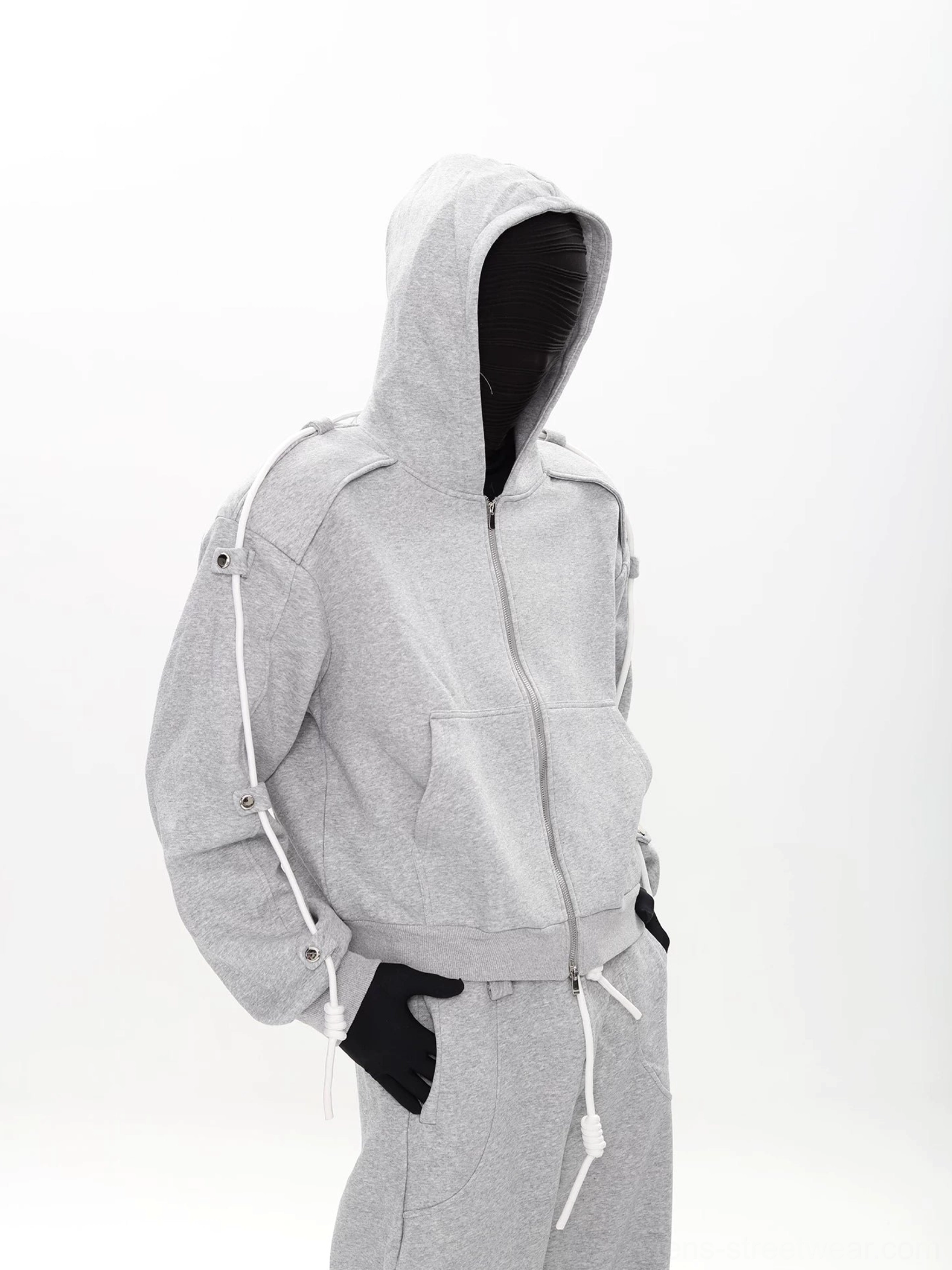 Side view of heather gray cropped modular zip hoodie and loose wide-leg sweatpants in Korean streetwear styling