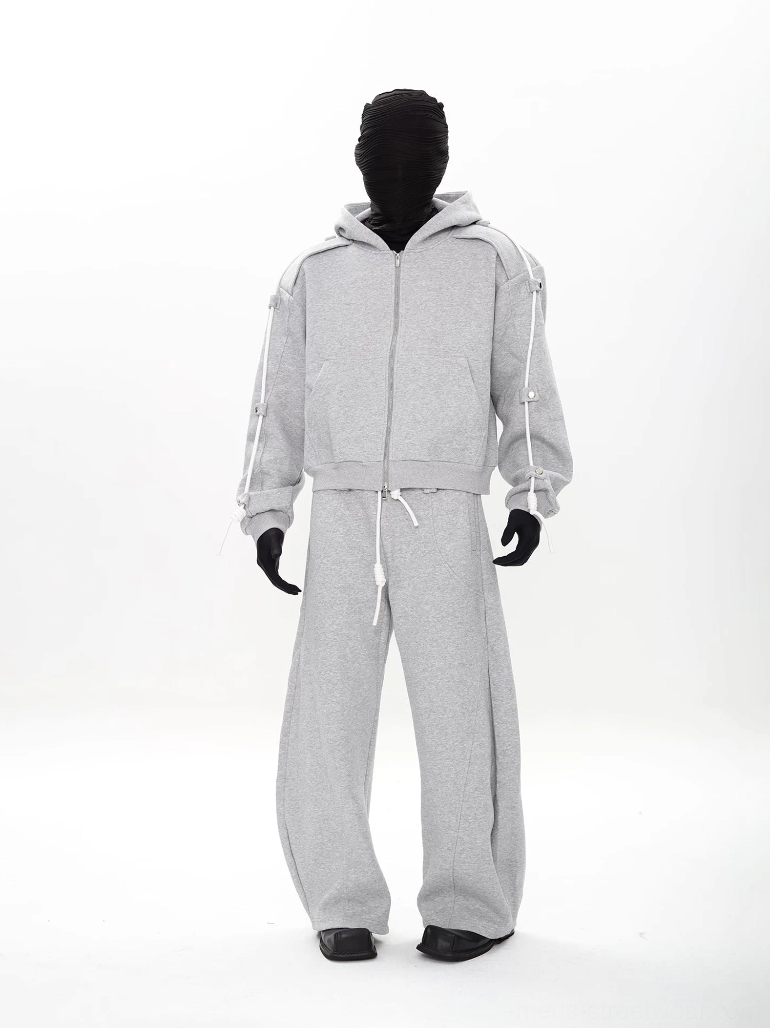Heather gray modular hoodie and wide-leg sweatpants set featuring adjustable shoulder drawcords and metal snap-tab details