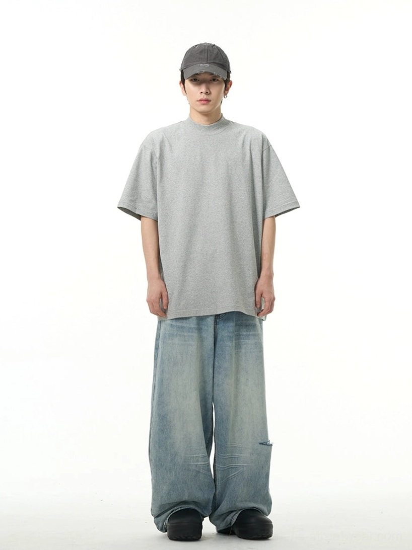 Heather gray oversized crew neck short sleeve T-shirt styled with ripped wide leg jeans