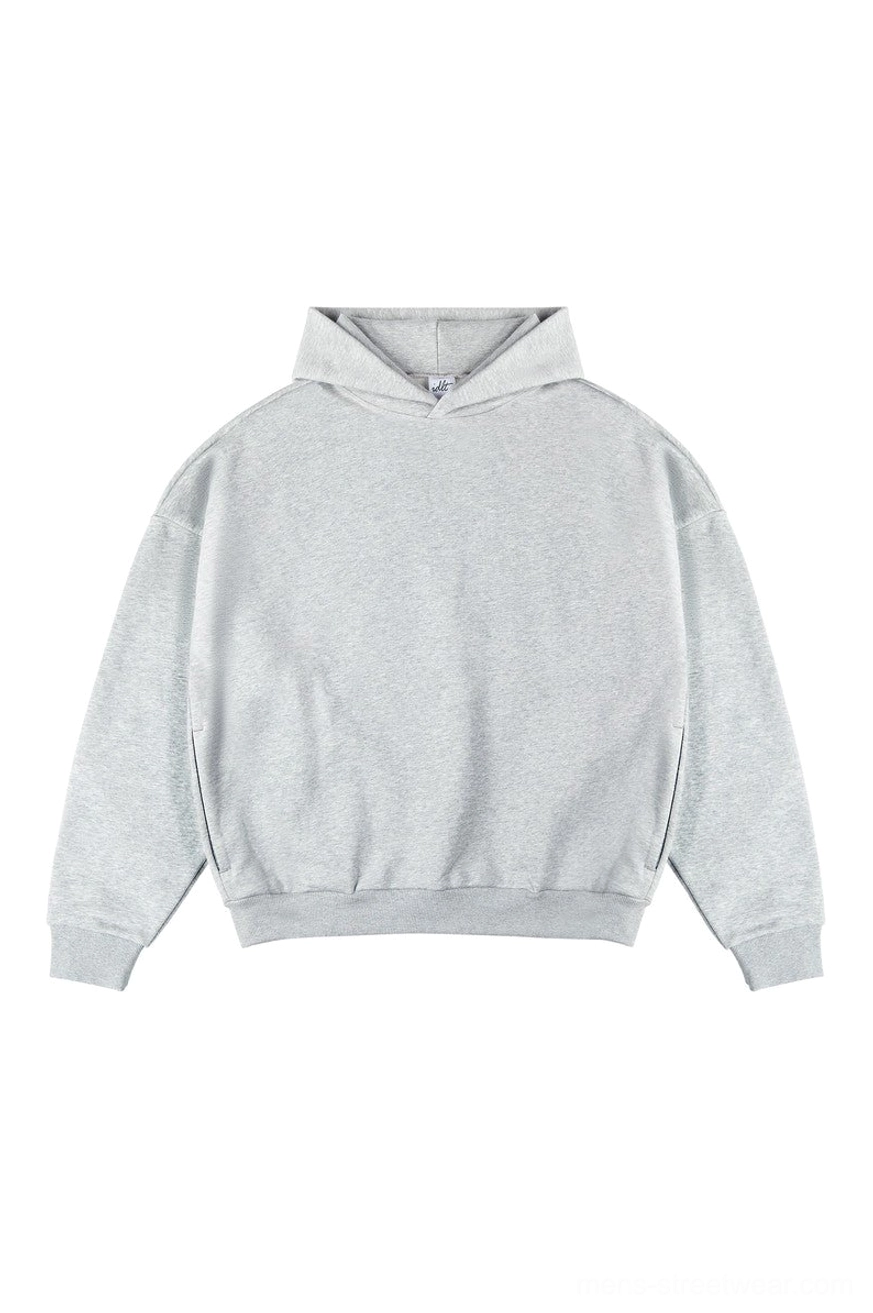 Heather gray oversized unisex hoodie with textured fabric and ribbed cuffs
