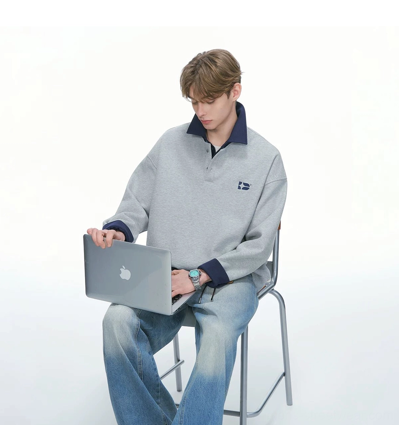 Heather gray oversized varsity collar sweatshirt worn with relaxed denim jeans for a casual everyday streetwear outfit