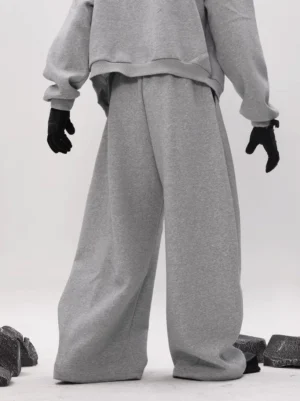 Heather gray oversized wide leg fleece sweatpants with dramatic balloon silhouette, thick white drawstring waistband, and relaxed Korean streetwear styling