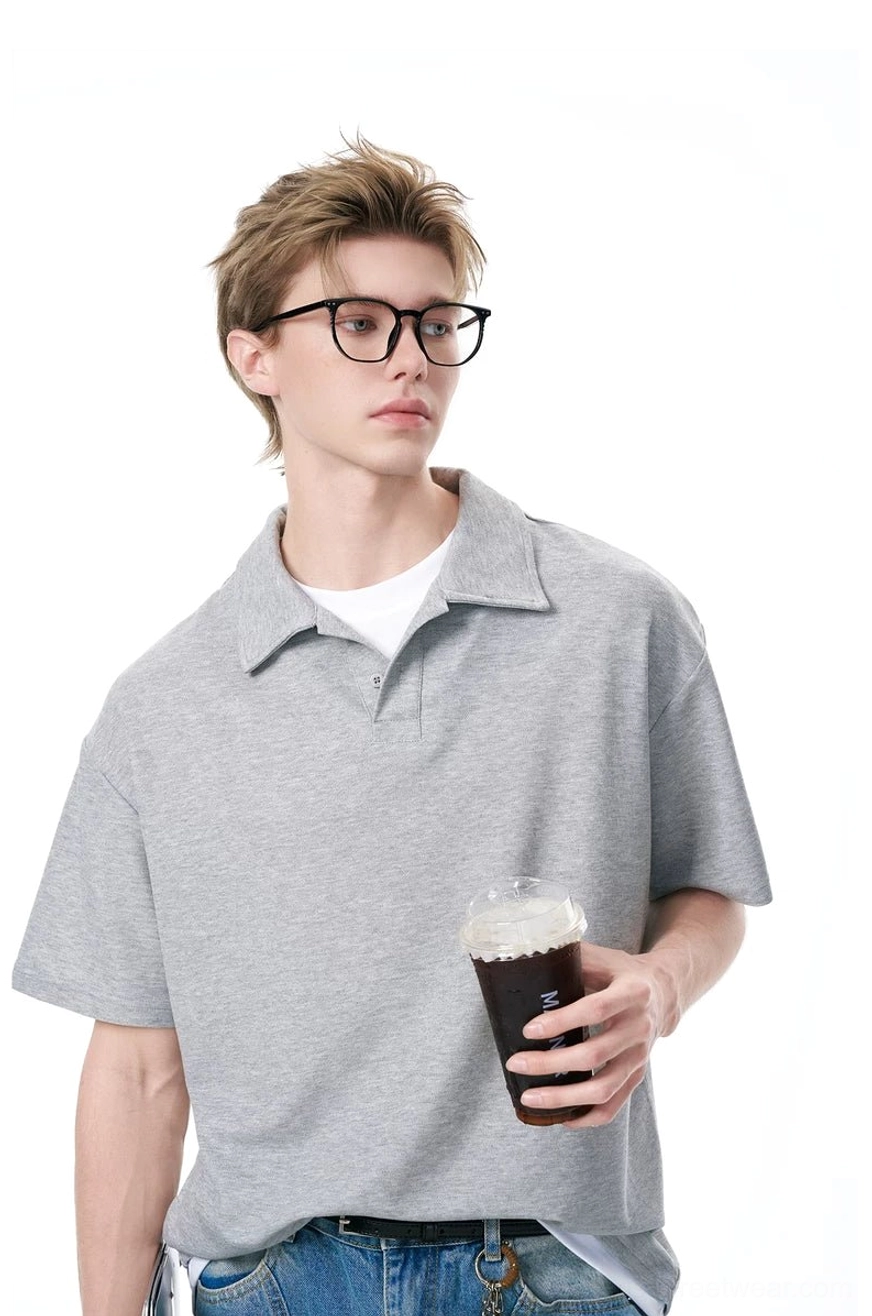 Heather gray relaxed fit knit polo shirt with classic collar styled for an everyday coffee run