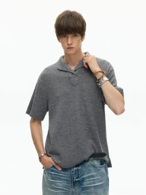 Heather gray textured shawl collar knit polo tee with relaxed fit styled with straight blue jeans and wrist accessories for Seoul-inspired streetwear