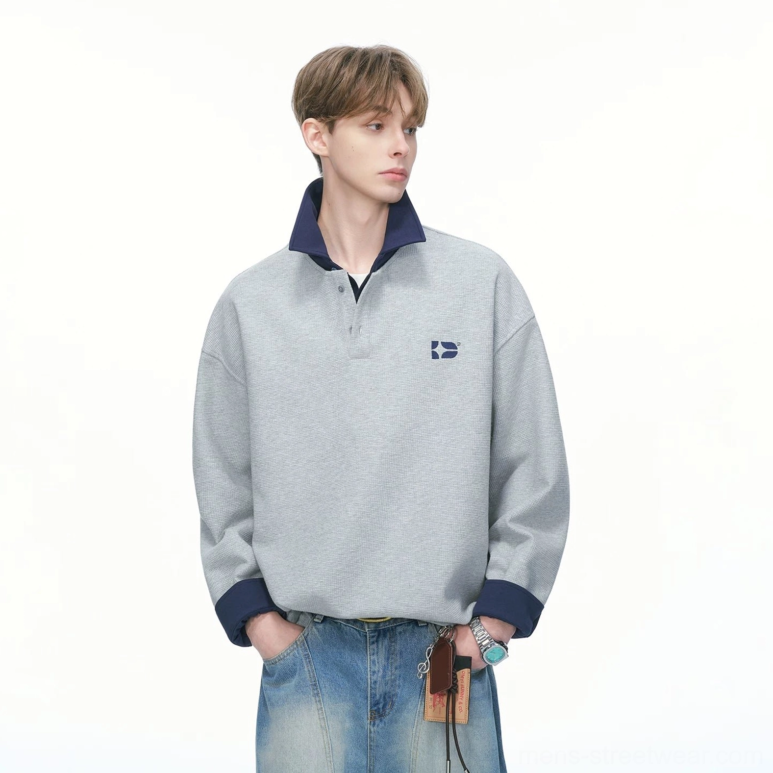 Heather gray varsity collar rugby sweatshirt colorway with dark blue trim relaxed streetwear fit and embroidered chest accent