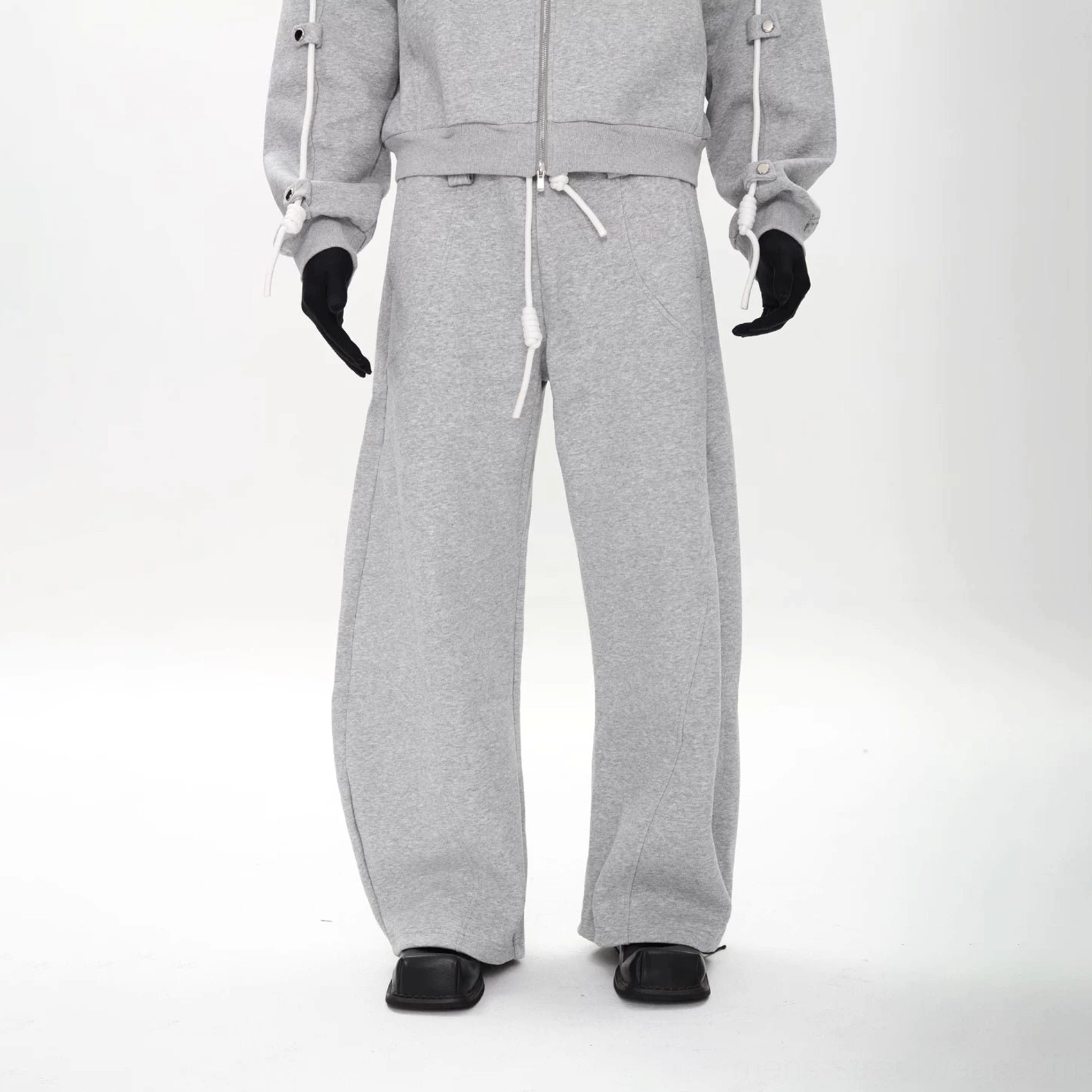 Heather gray wide-leg fleece sweatpants with elastic drawstring waist and oversized relaxed streetwear fit
