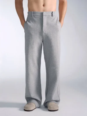 Close-up front view of heather gray wide-leg sweatpants with belt loops flat waistband and tailored streetwear silhouette