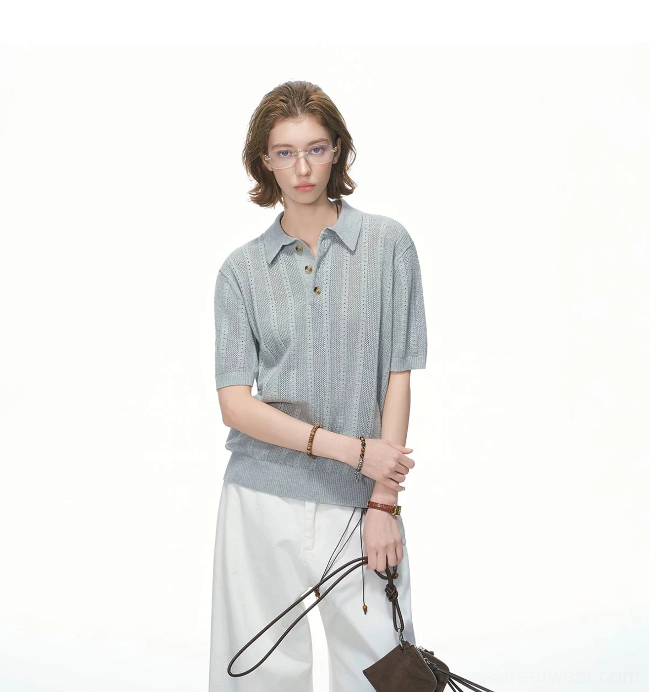 Front view of heather grey cotton pointelle knit polo shirt with ribbed hem and multi-button polo placket