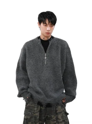 Heather grey distressed cross-zipper half-zip oversized streetwear sweater styled with camouflage cargo pants