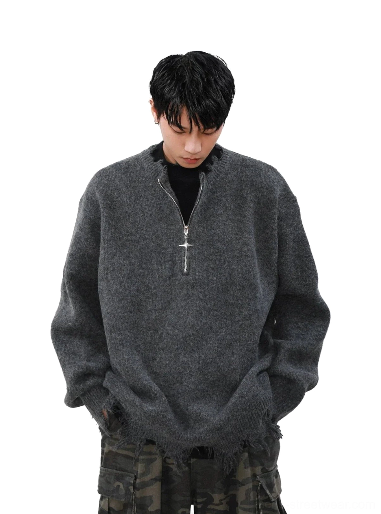 Front view of a loose fit heather grey cross zipper sweater with distressed cuffs and raw hem