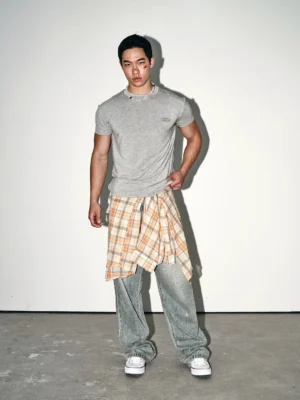 Front view of heather grey minimal embroidered slim fit crew neck streetwear tee with plaid shirt tied at waist