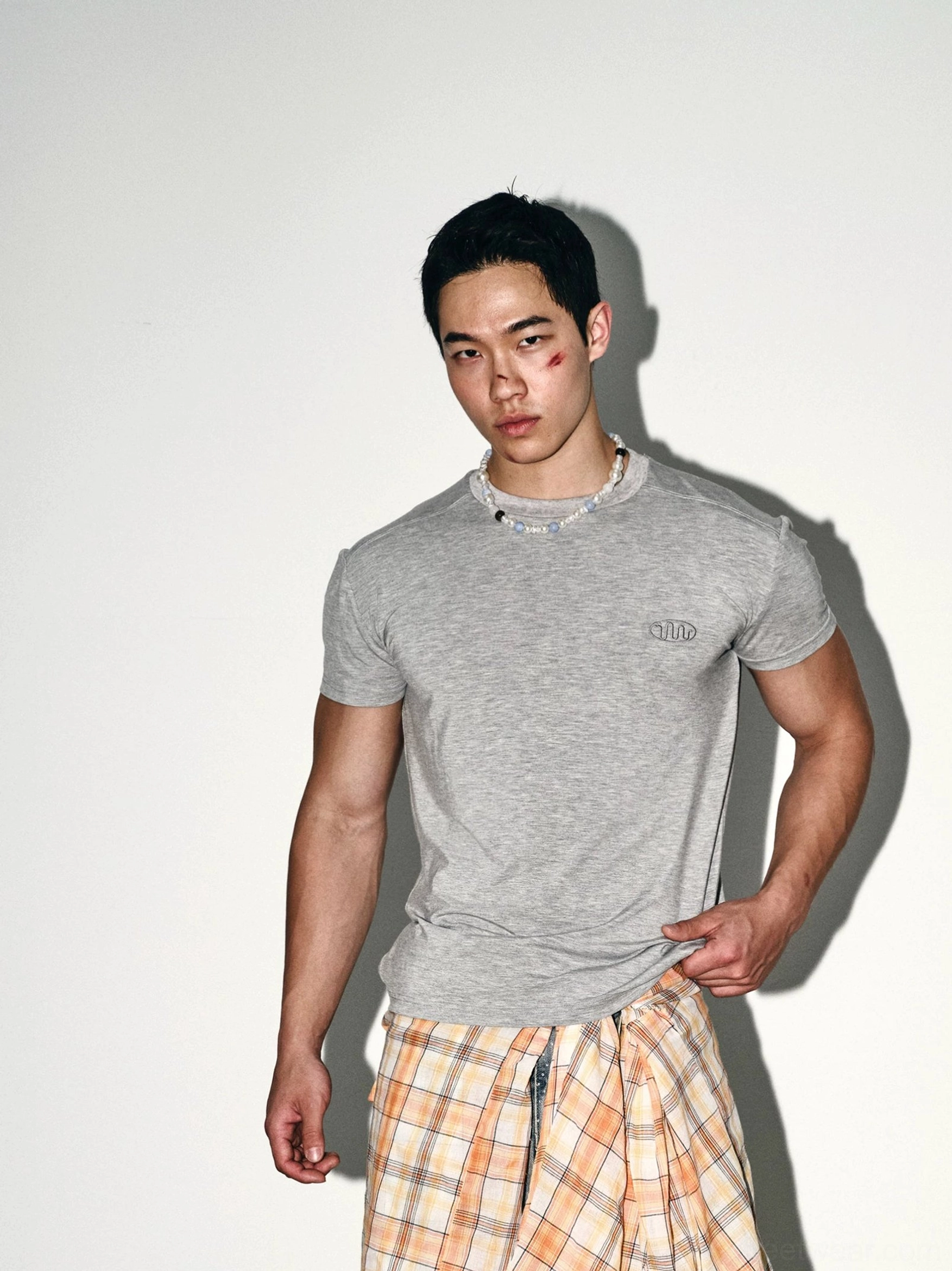 Heather grey slim fit embroidered crew neck tee showing soft stretch fabric and tailored streetwear silhouette