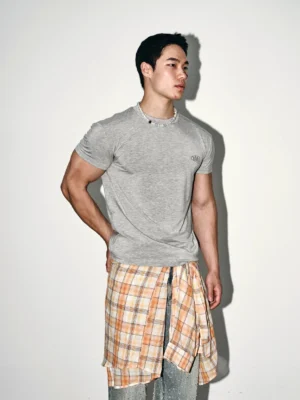 Heather grey minimal embroidered slim fit streetwear tee worn by male model in three-quarter full body studio view