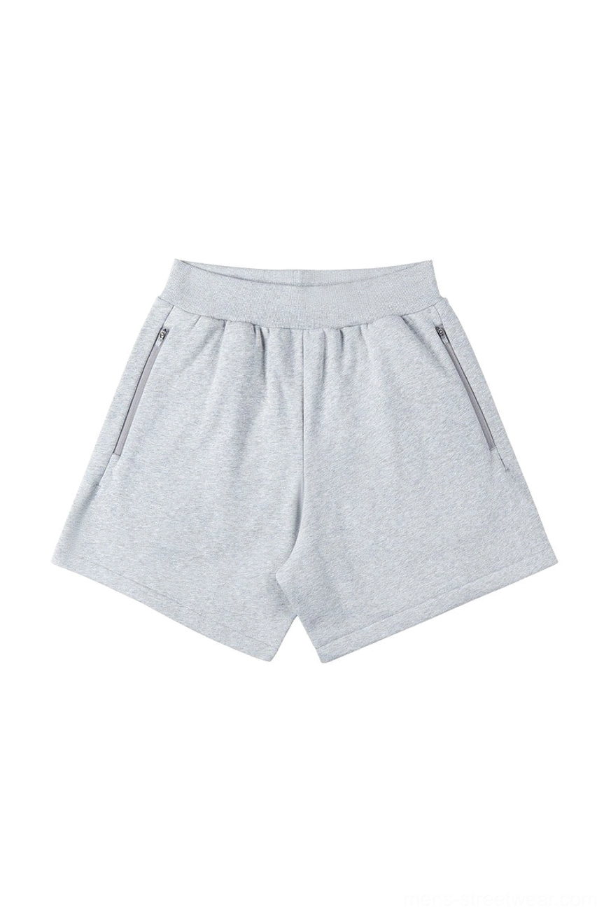 Heather light gray cotton blend streetwear sweat shorts with loose straight-leg fit, ribbed waistband, and two zippered side pockets