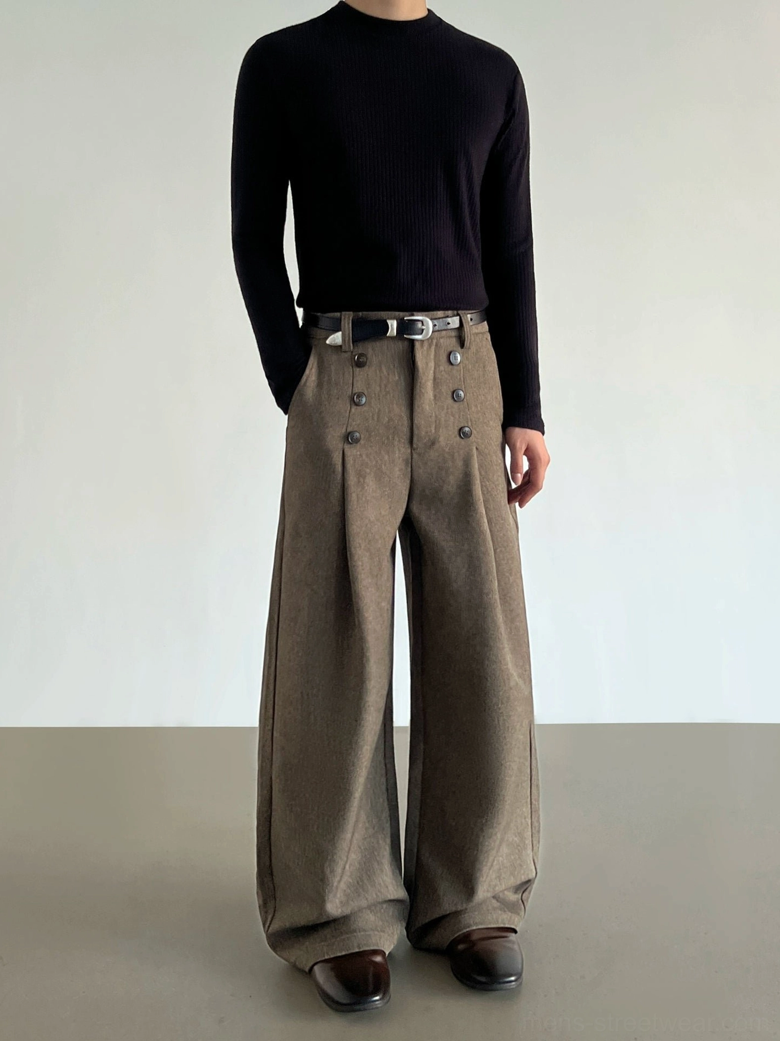 Three-quarter view of heathered brown wide-leg trousers featuring a high buttoned waist, front pleats, and tailored Korean streetwear silhouette
