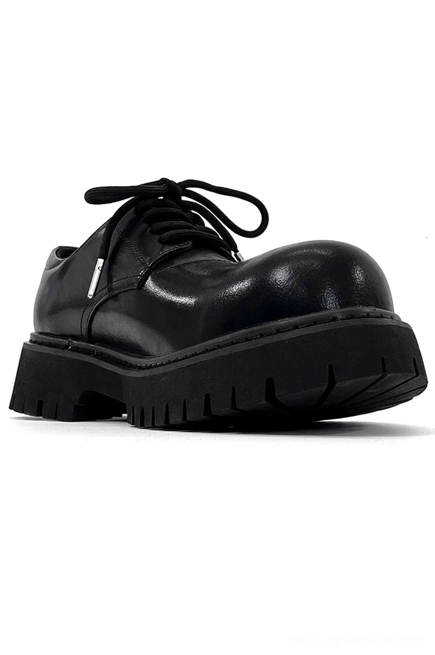 Heavy sole black derby shoes with minimalist upper and contemporary Japanese streetwear influence