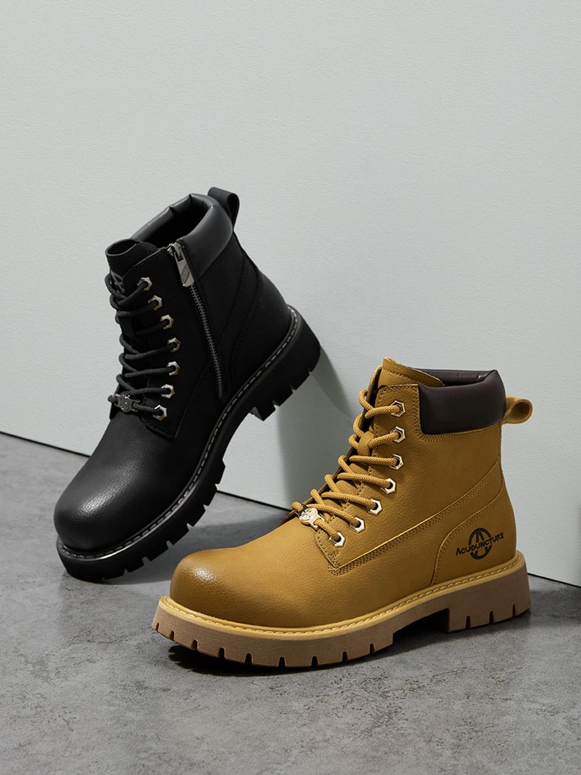 Heavy-looking utility ankle boots with padded collar and thick rubber sole for contemporary casual wear