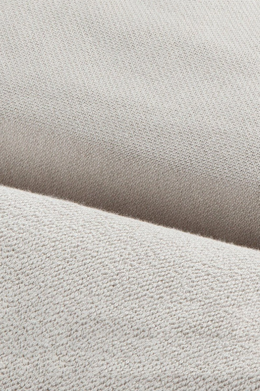 Heavyweight cotton hoodie fabric close up showing smooth outer knit and soft brushed fleece lining