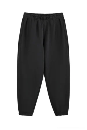 Black heavyweight oversized cotton sweatpants with elastic waistband tapered cuffs and side pockets front flat lay