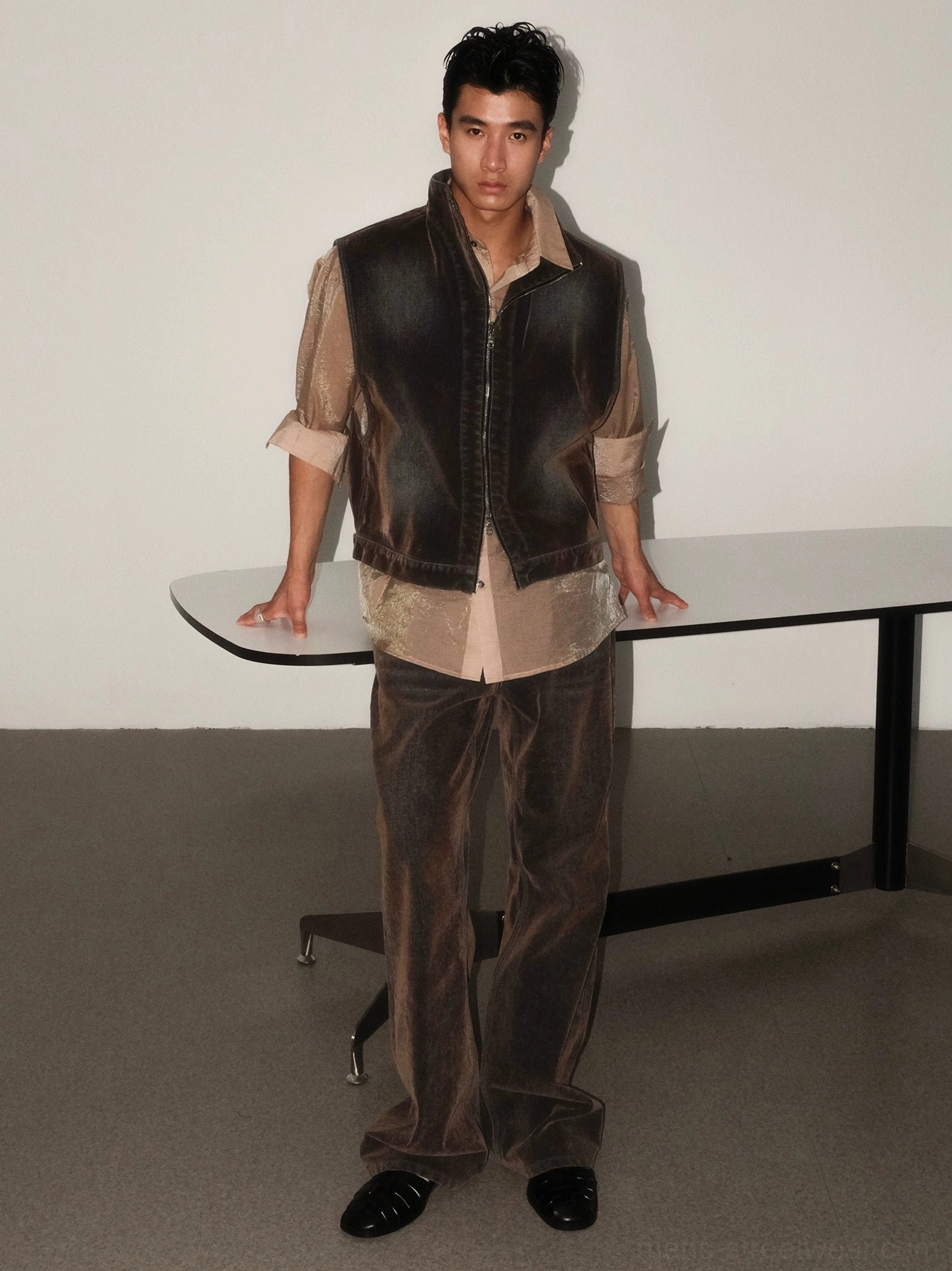 High rise faded brown flare jeans front view showing classic pockets relaxed thigh and wide hem