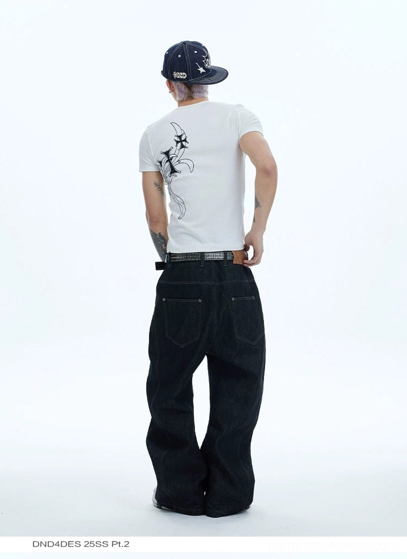 Rear view of high-waisted black asymmetric wide-leg jeans with belt loops and relaxed baggy silhouette