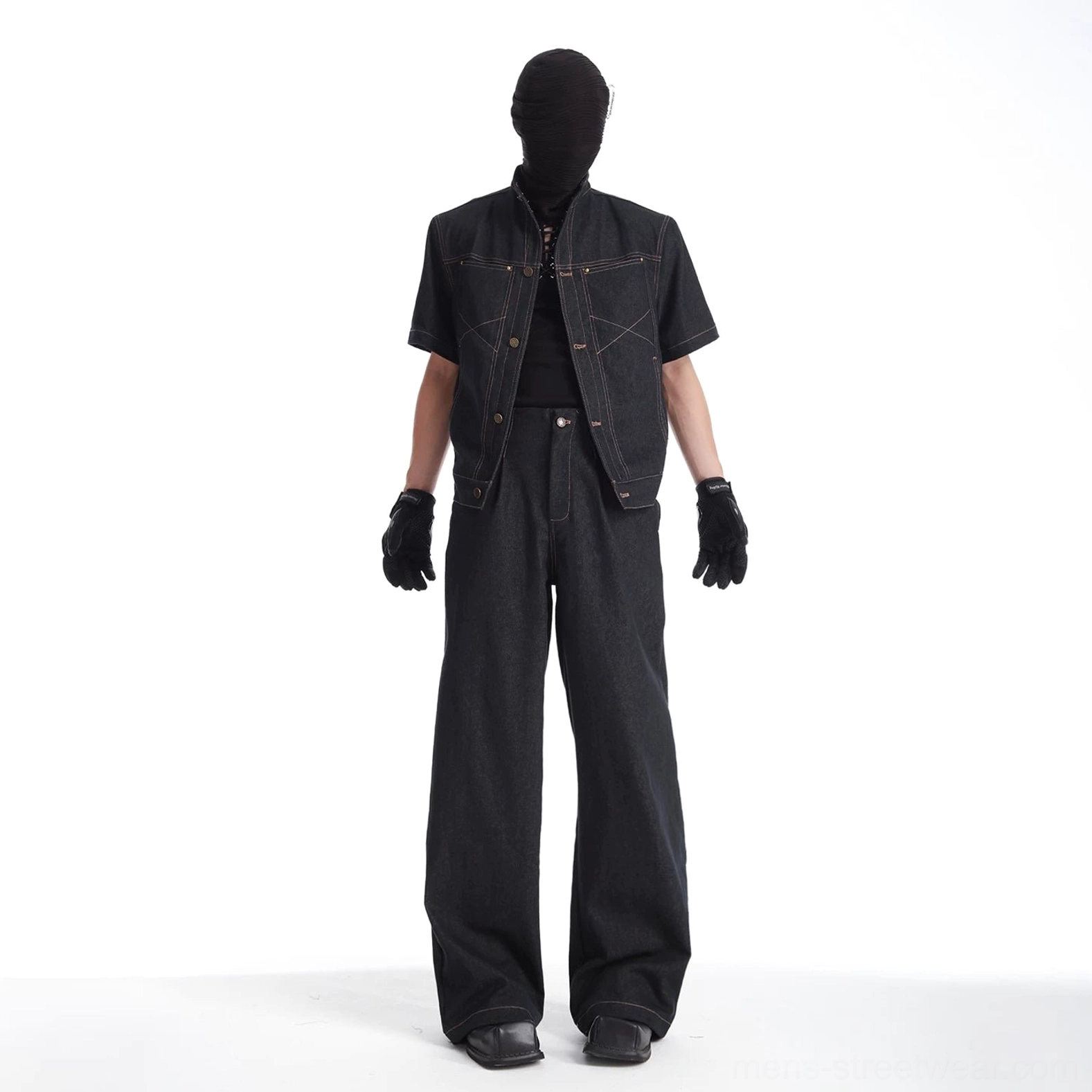 High-waisted black wide-leg denim trousers shown from the front with zip button closure belt loops and relaxed tailored seams