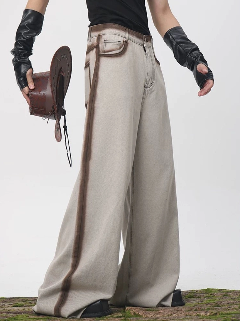 Side view of high waisted wide leg faded oat denim pants with a brown contrast side stripe styled with a cropped denim jacket