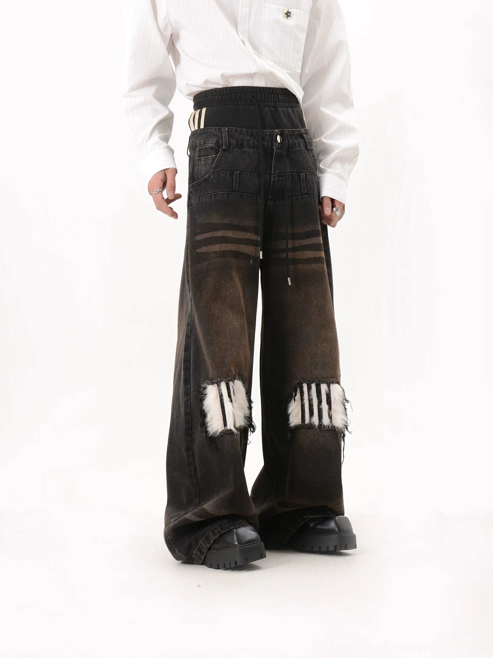 Right side three quarter view of high waisted wide leg jeans with gradient washed denim, striped waistband tabs, faux fur knee patches and practical side pockets
