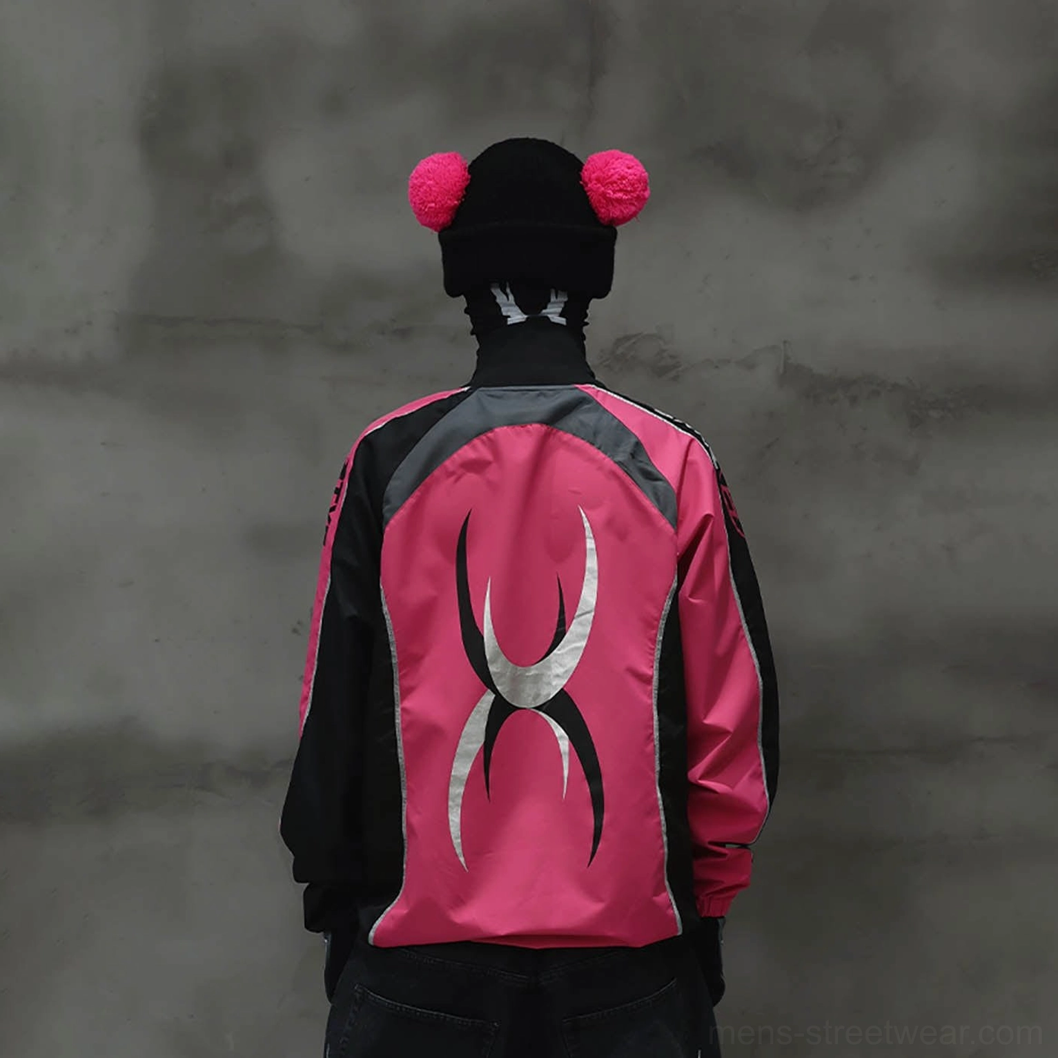 Rear view of hot pink racing raglan jersey with silver tribal-inspired graphic and black contrast panels