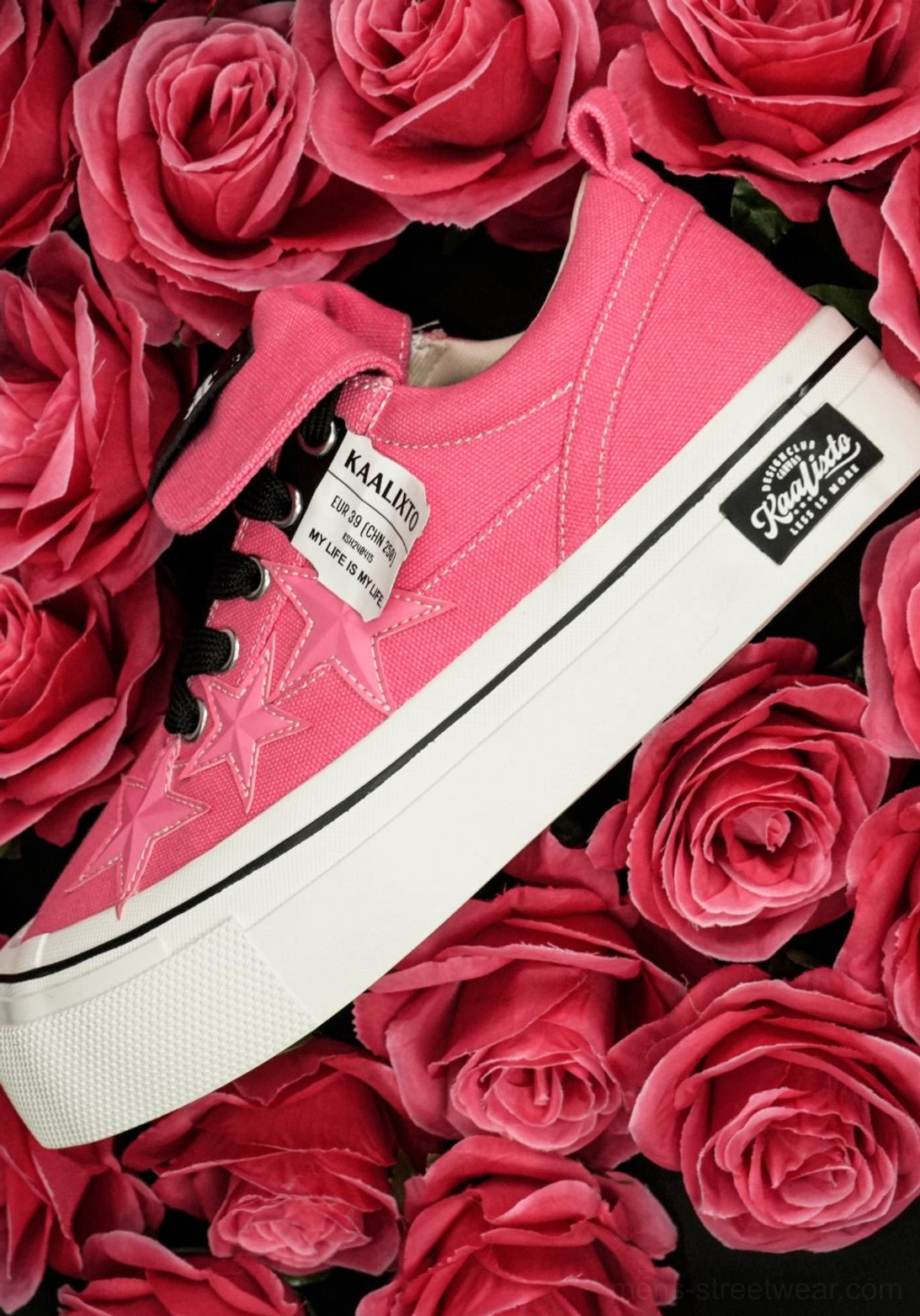 Hot pink star sneakers with layered canvas upper, white platform rubber sole, and expressive Seoul fashion aesthetic