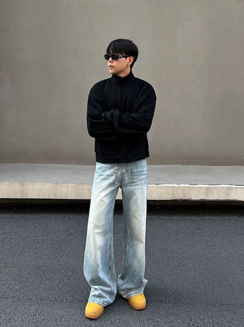 Front full-body view of ice fade light blue wide straight leg jeans with acid wash denim and relaxed Korean streetwear silhouette