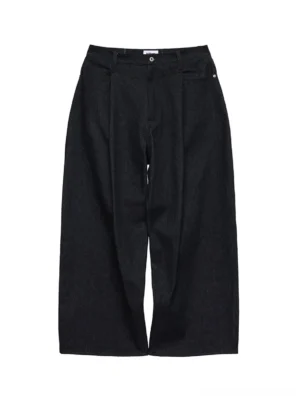 Dark indigo non-fade wide-leg denim pants shown from the front with high waist, front pleats, and relaxed streetwear silhouette