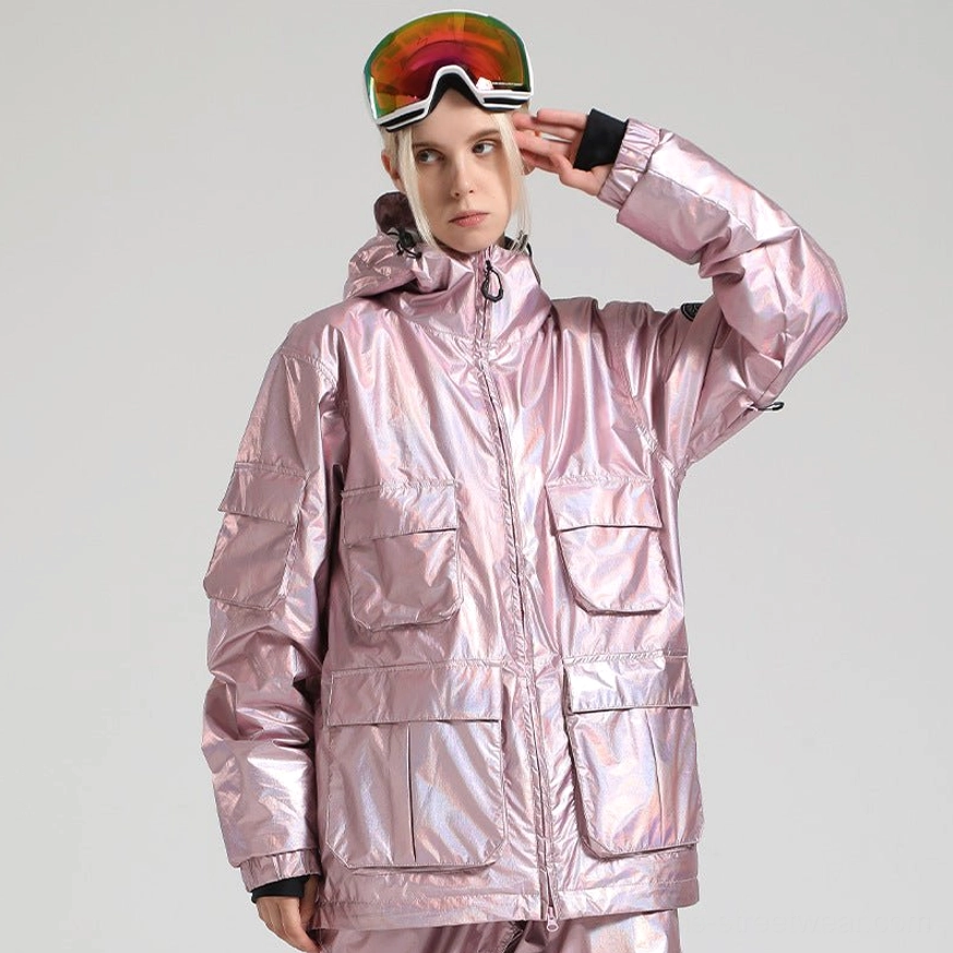Iridescent pink ski storm shell jacket with holographic finish, hood, front cargo pockets, zip closure, and ski goggles styling