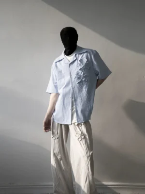 Light blue 3D iris floral pinstripe camp shirt styled with off-white wide-leg trousers in a relaxed Korean streetwear outfit