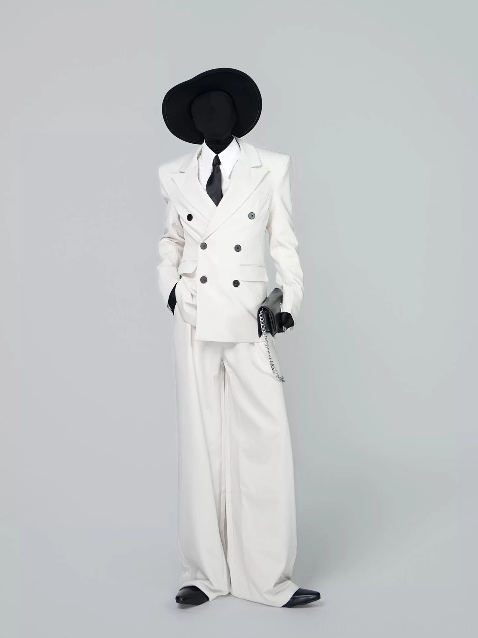 Ivory double-breasted power suit set with padded shoulders and wide-leg tailored trousers front three-quarter view