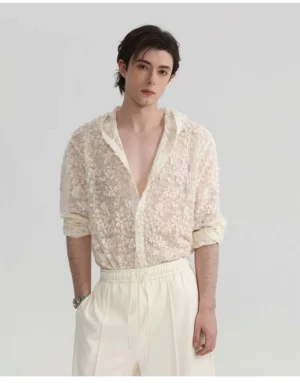 Front upper body view of an ivory floral lace hooded shirt with sheer embroidered fabric, open V-neck, rolled sleeves, and relaxed Korean streetwear styling