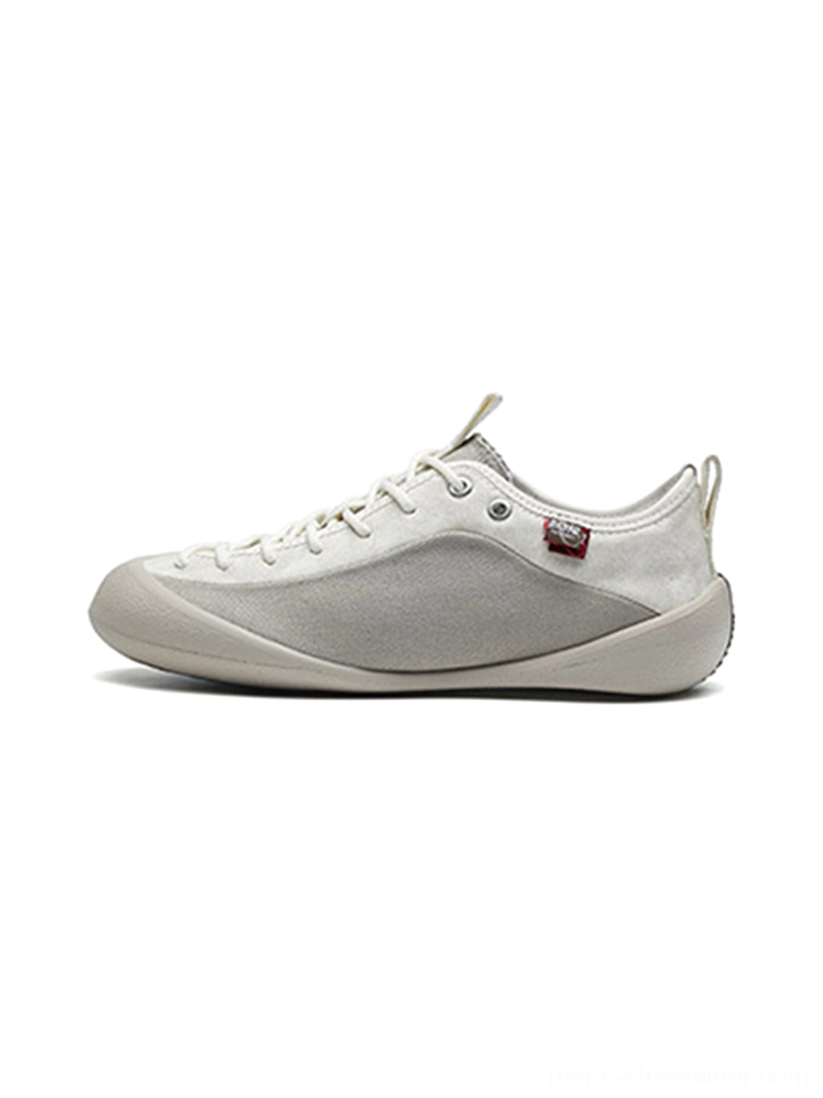 Ivory mesh-panel canvas low-top sneakers shown from the left side with layered canvas panels, suede-textured toe and heel accents, woven laces, and a slim rubber sole