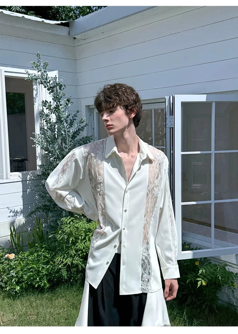 Side outdoor styling view of men's ivory lace panel oversized longline shirt near a garden and window