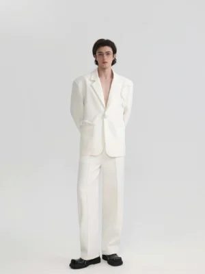 Back view of ivory oversized tailored blazer showing clean single-breasted silhouette and relaxed menswear fit