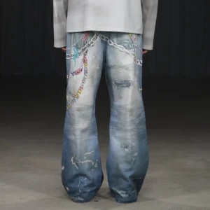 Rear view of faded blue wide leg kawaii streetwear jeans featuring multicolor decorative chains, distressed wash and oversized denim silhouette