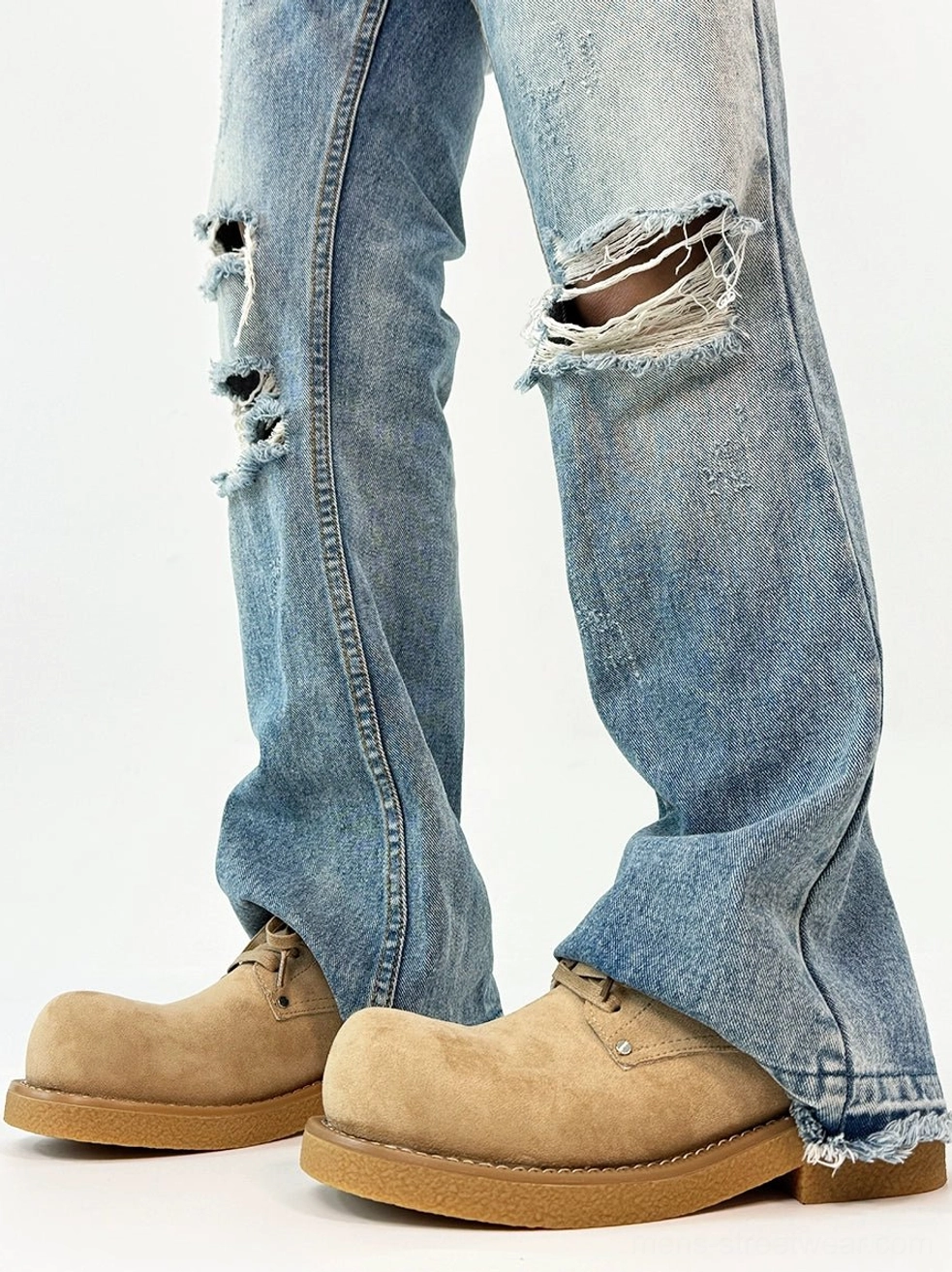 Khaki suede chunky platform derby shoes worn with frayed hem flared jeans and a bold rounded rubber sole
