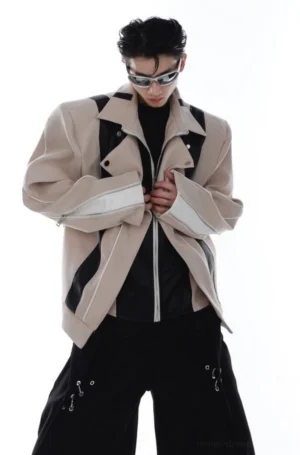 Khaki deconstructed color-block oversized faux leather biker jacket front three-quarter view with black contrast panels