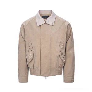 Khaki cropped bomber jacket with layered houndstooth collar, flame embroidery, front zipper, and elasticated hem shown in a studio flat lay